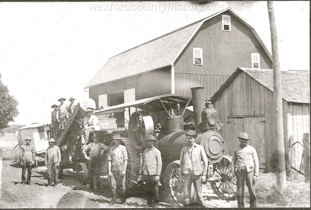 Farmers Pose Next To Their Steam Tractor