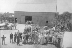 Local Gathering In Front Of A Barn