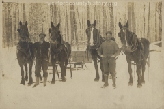 Cadillac-Lumber-Two-Lumberjacks-With-Two-Horse-Teams-And-Empty-Sled