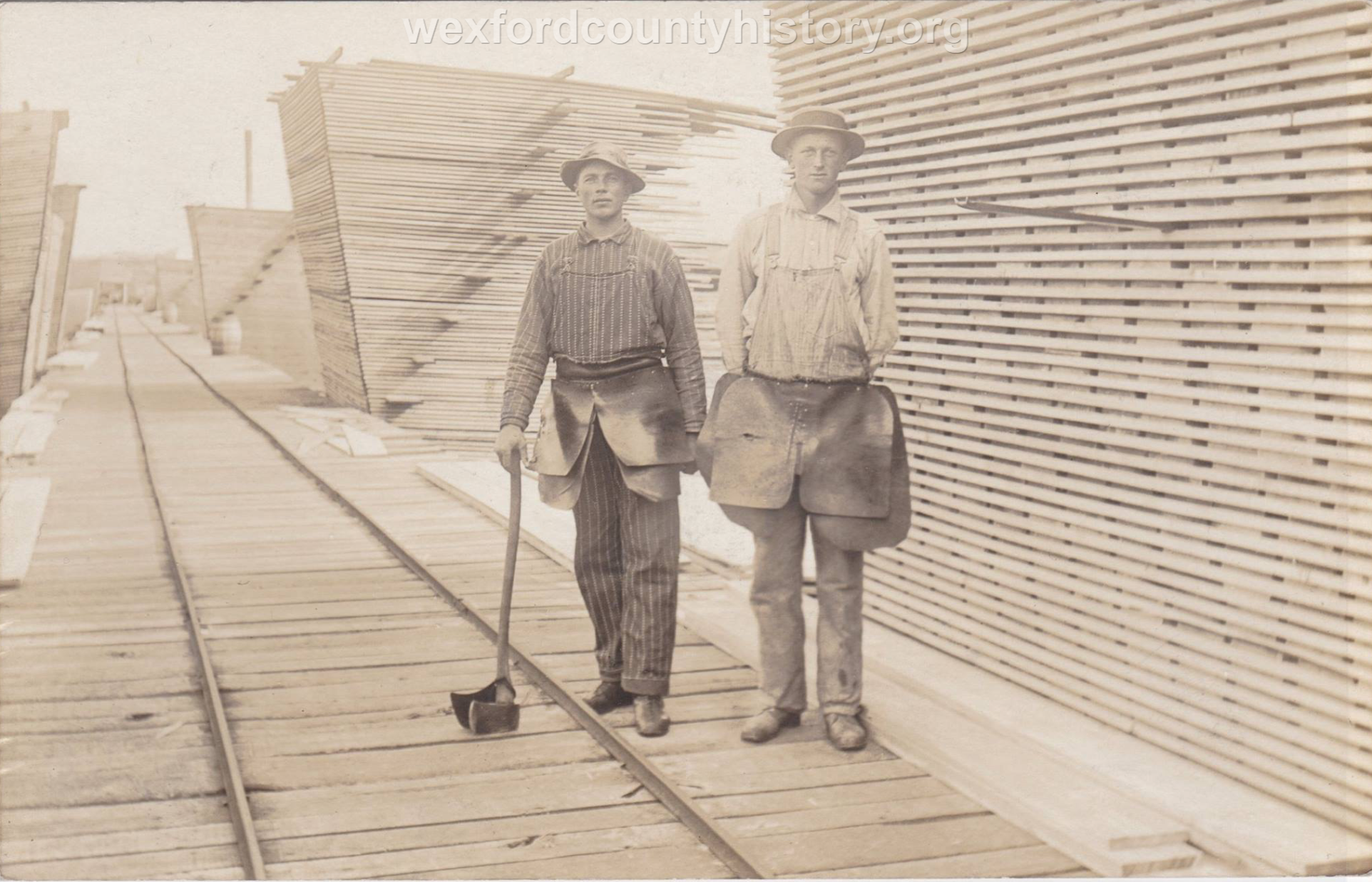Cadillac-Lumber-Mill-Workers-On-The-Tramway-In-The-Storage-Yards
